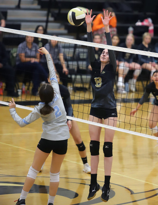 Prairie View's Paige Walker goes for a block during an Oct. 27 match against Mountain Rang's Ava Zamboni.